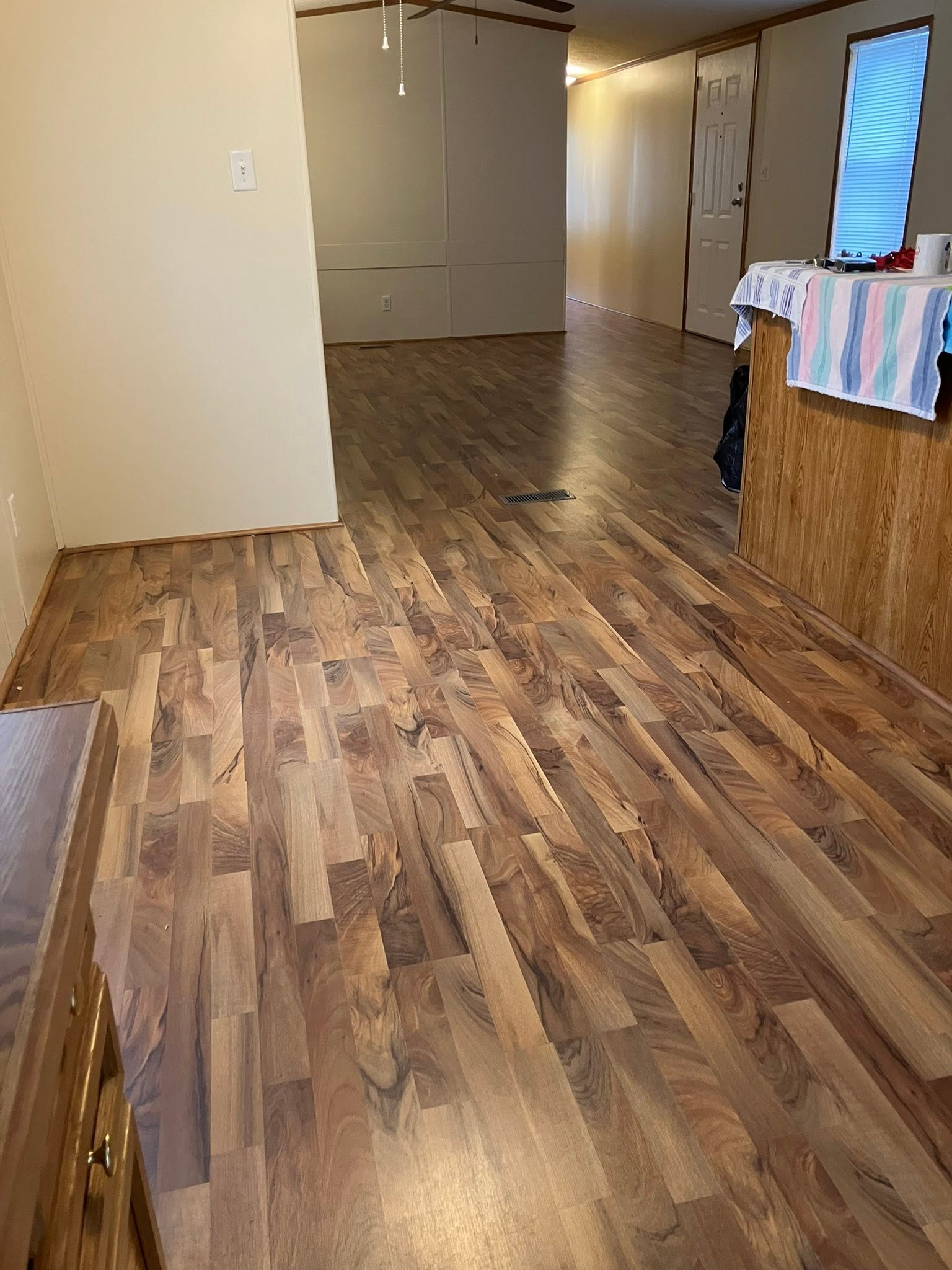 New wood-look vinyl plank flooring running through an open living area.